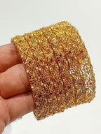 Gold filigree bridal bangles with ruby stones - front view