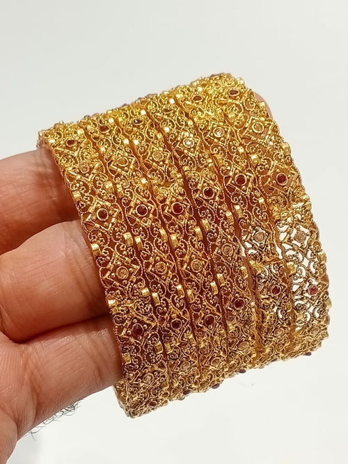 Gold filigree bridal bangles with ruby stones - front view